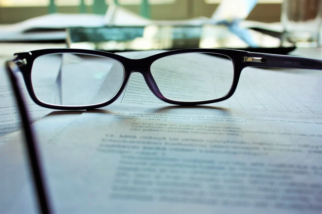 minister's glasses resting on documents