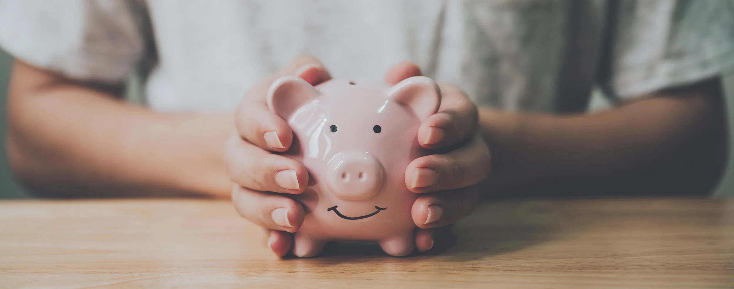 holding piggy bank
