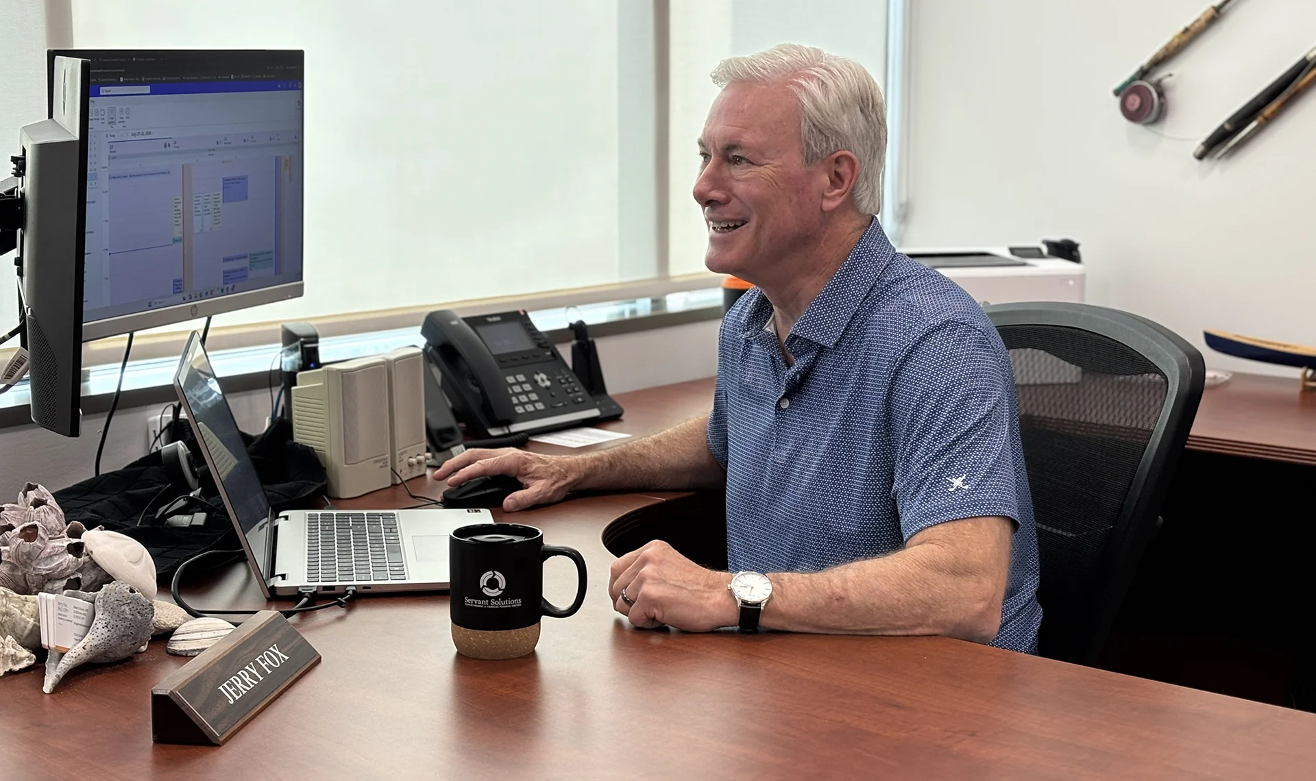 Jerry Fox Servant Solutions at his desk