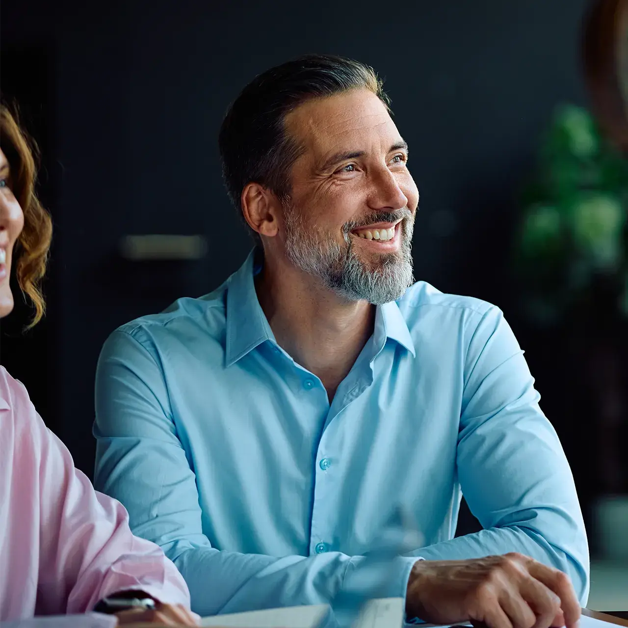business man smiling during financial planning meeting