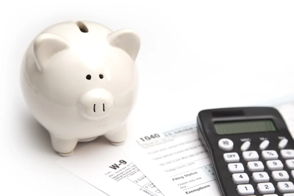 piggy bank with tax forms