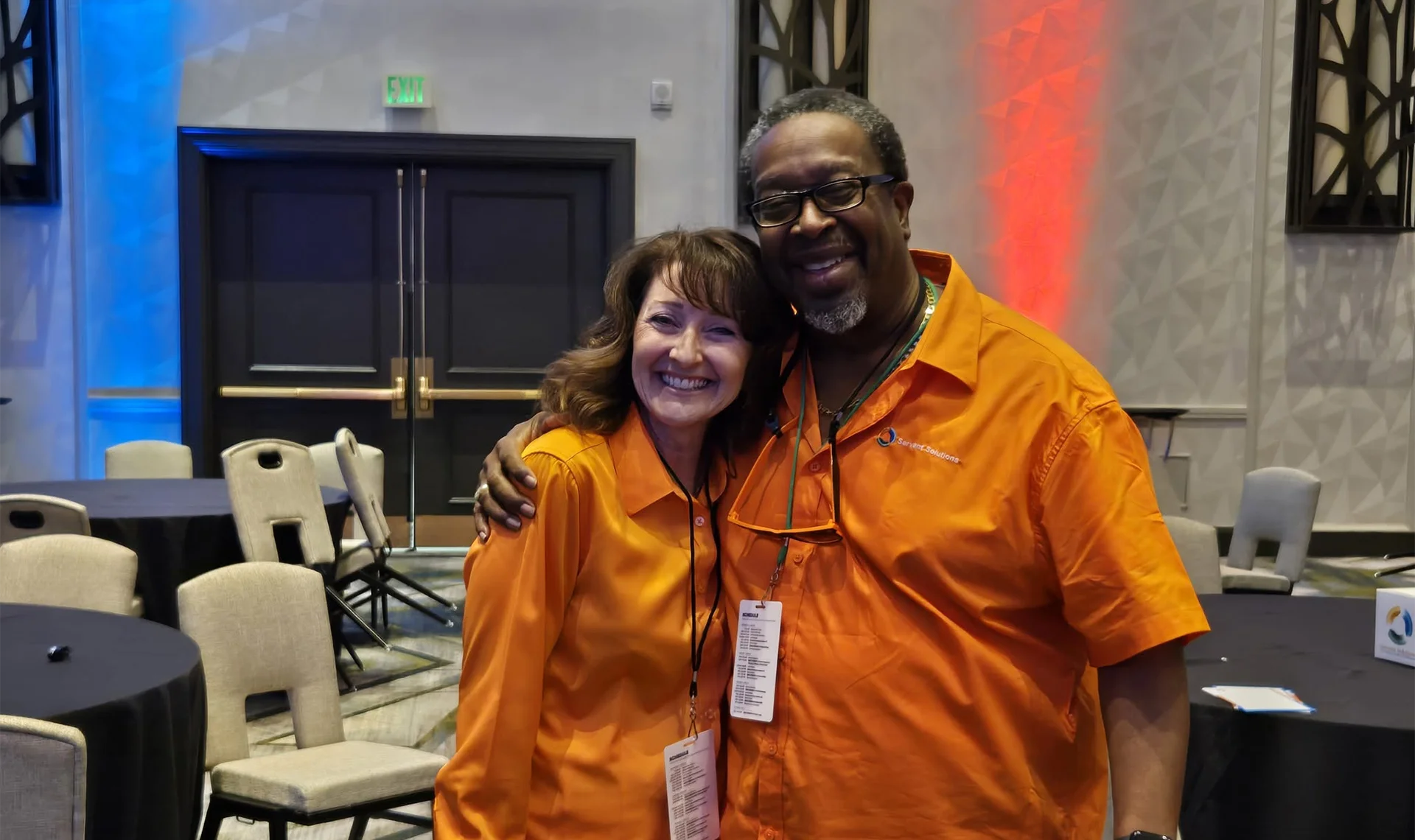 servant solutions team smiling at event
