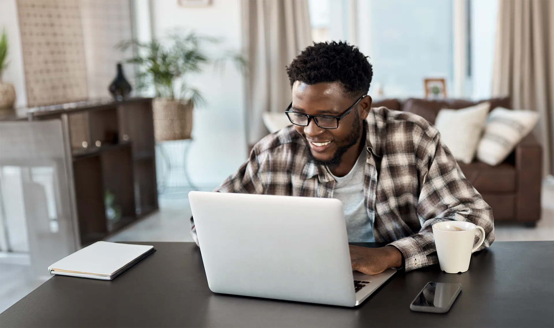 man reviewing retirement plan documents at home
