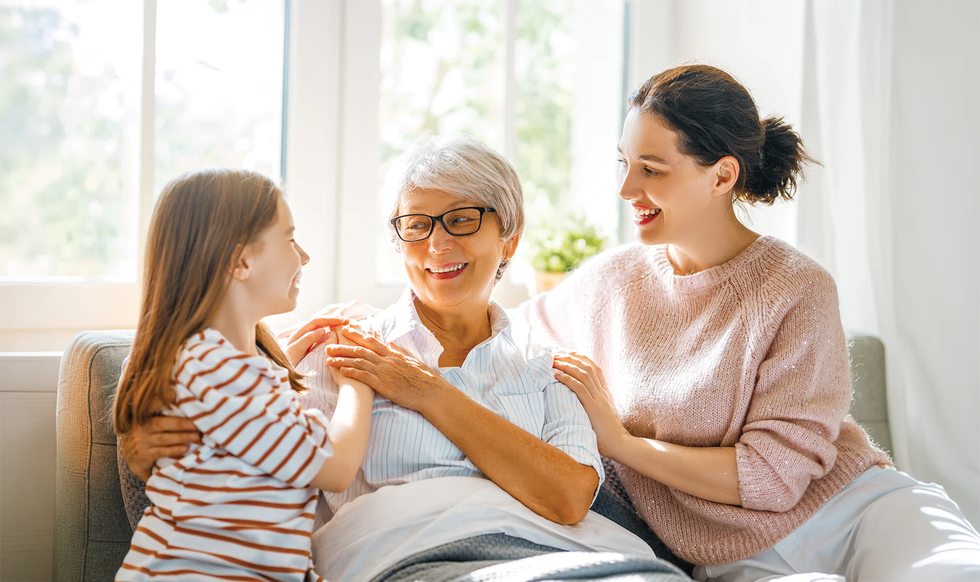 three generations of women bonding at home